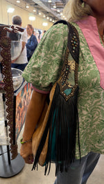 Heritage Brand Marilyn bag No. 1916 worn on the shoulder, tan side out, at the Dallas show