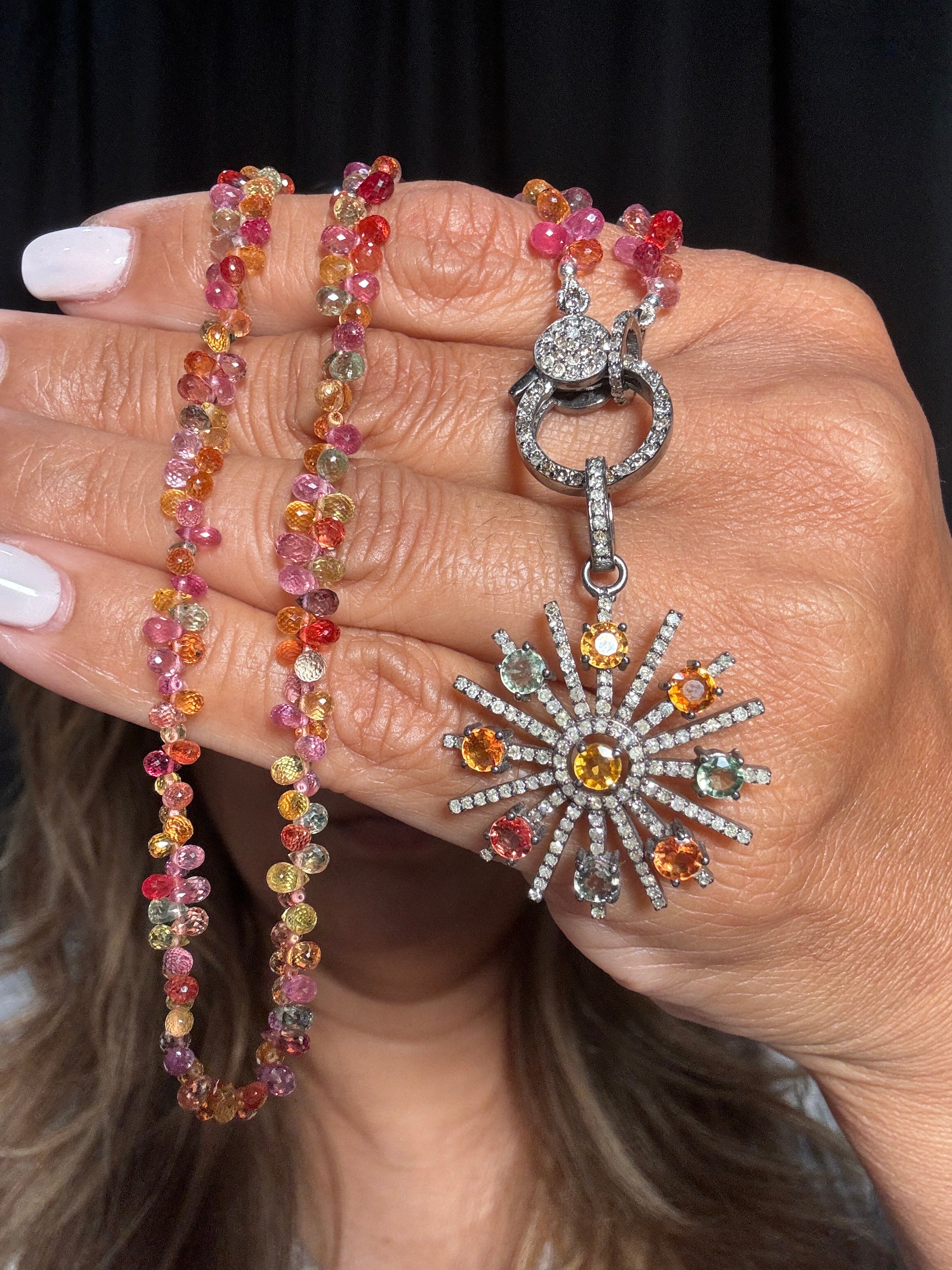 Multicolor Thai sapphire starburst pendant framed in diamonds, paired with a 16” faceted Thai sapphire necklace and pavé diamond clasp — a radiant, one-of-a-kind Ulka Rocks design.