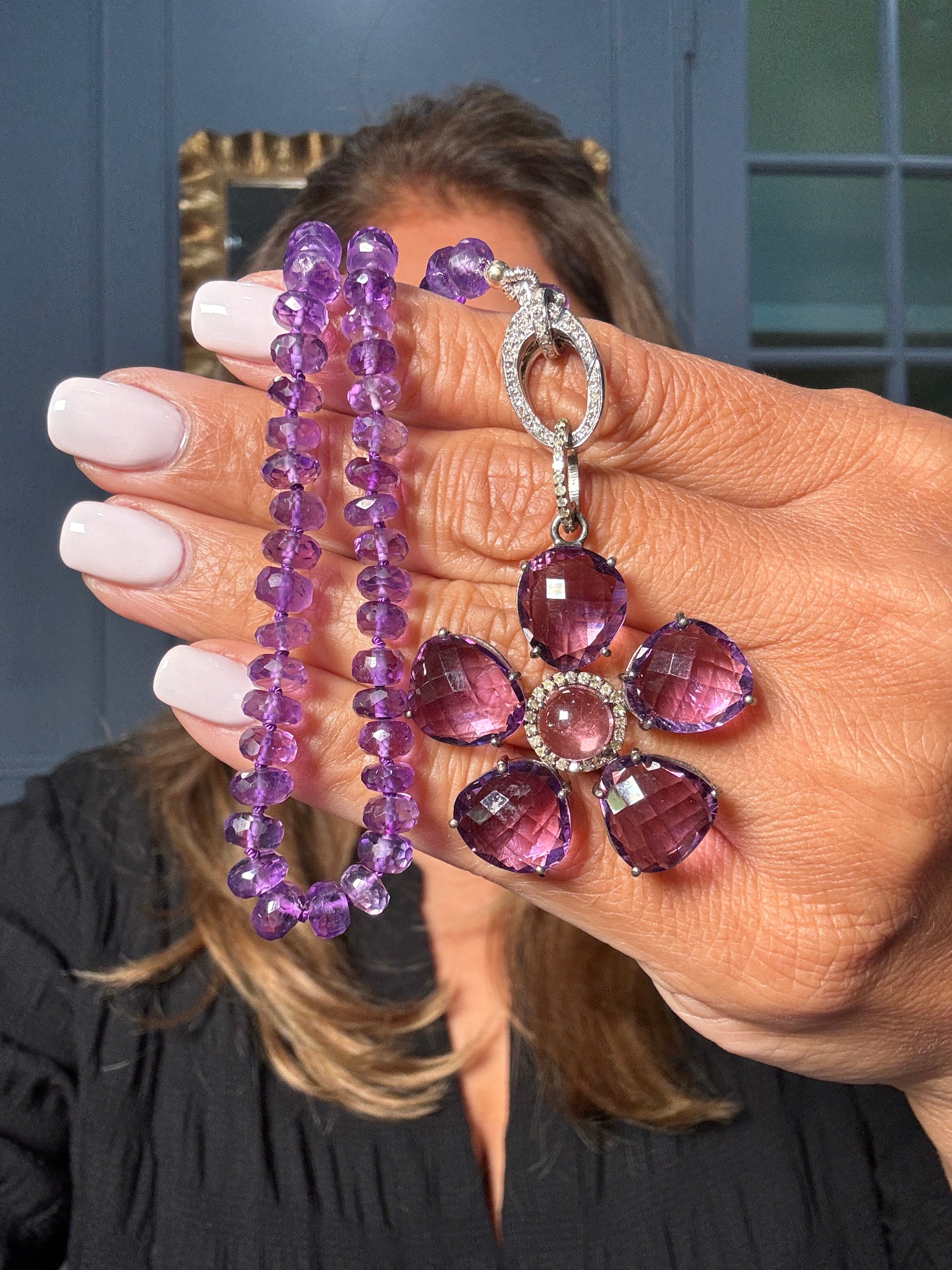 Faceted amethyst necklace with a sterling silver flower-shaped pendant, featuring purple amethyst petals and pavé diamonds. One-of-a-kind Ulka Rocks design.