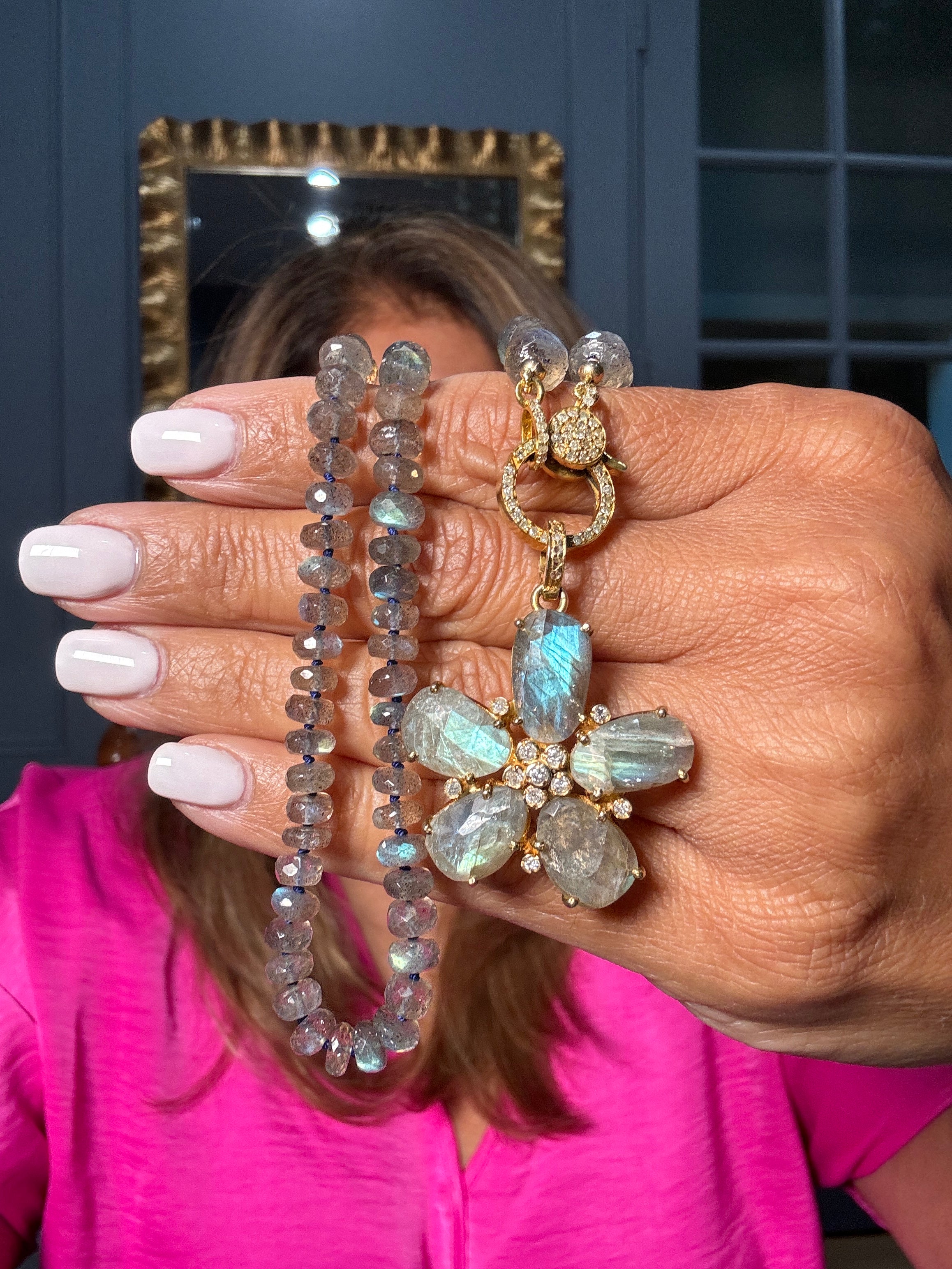 Faceted labradorite necklace with gold pavé diamond clasp, paired with a carved labradorite flower pendant set in gold-plated sterling silver. A one-of-a-kind Ulka Rocks piece.