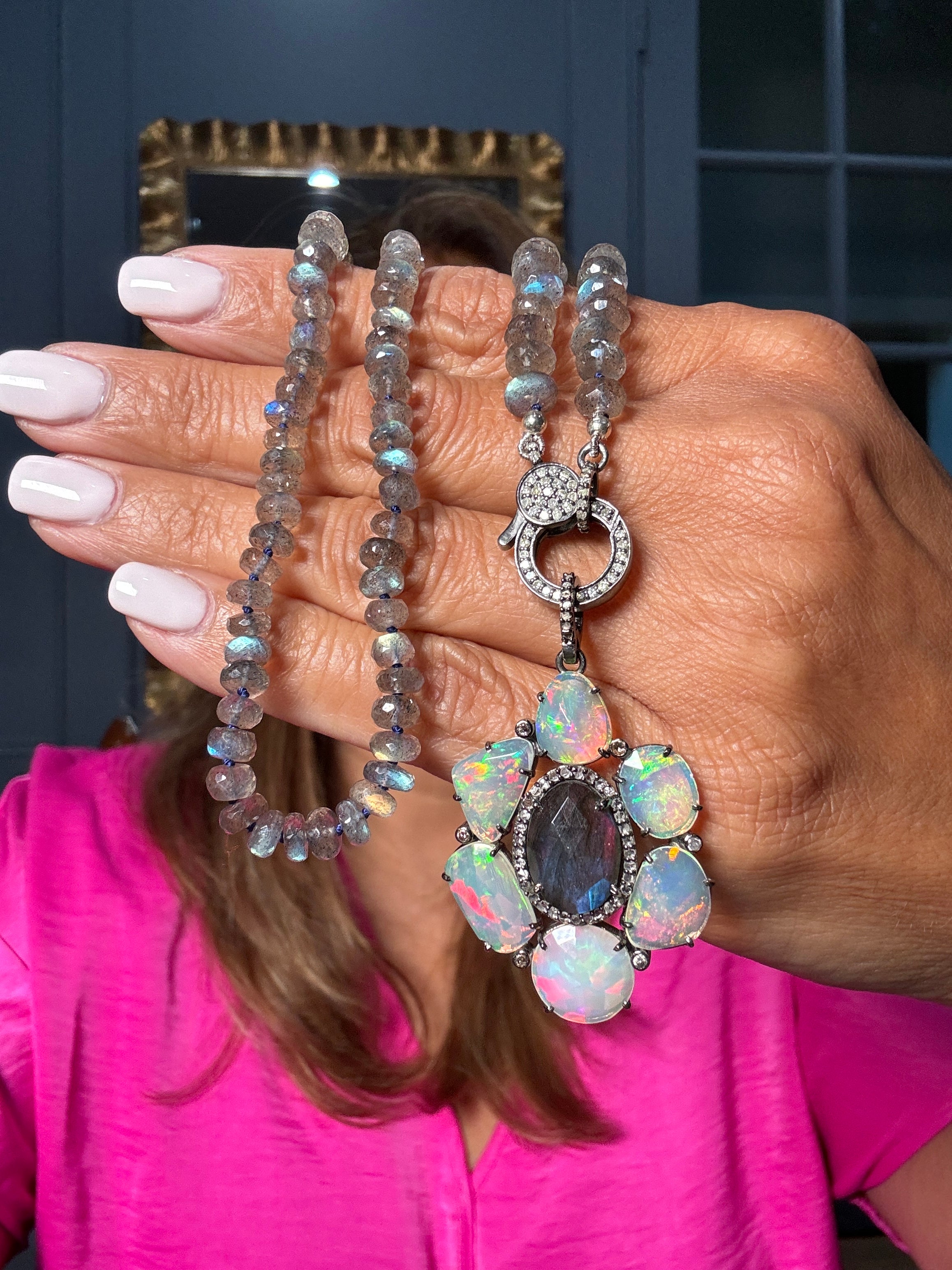 Faceted labradorite necklace with a sterling silver clasp and a pendant featuring a central labradorite surrounded by glowing opals, set in diamonds. A bold Ulka Rocks original.