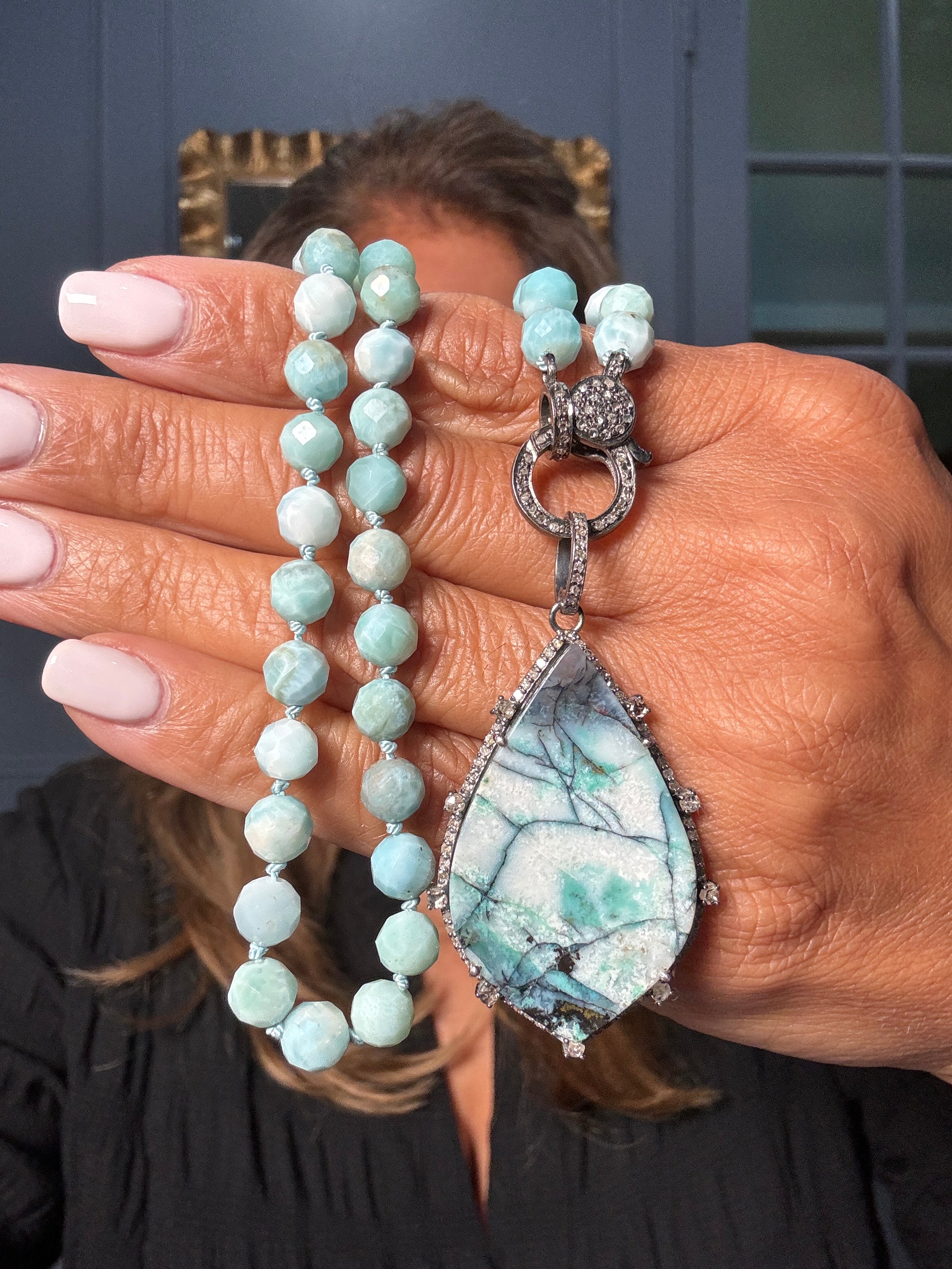 Faceted larimar necklace with a teardrop opalized wood pendant framed in diamonds and a pavé sterling silver clasp. Unique Ulka Rocks statement design.