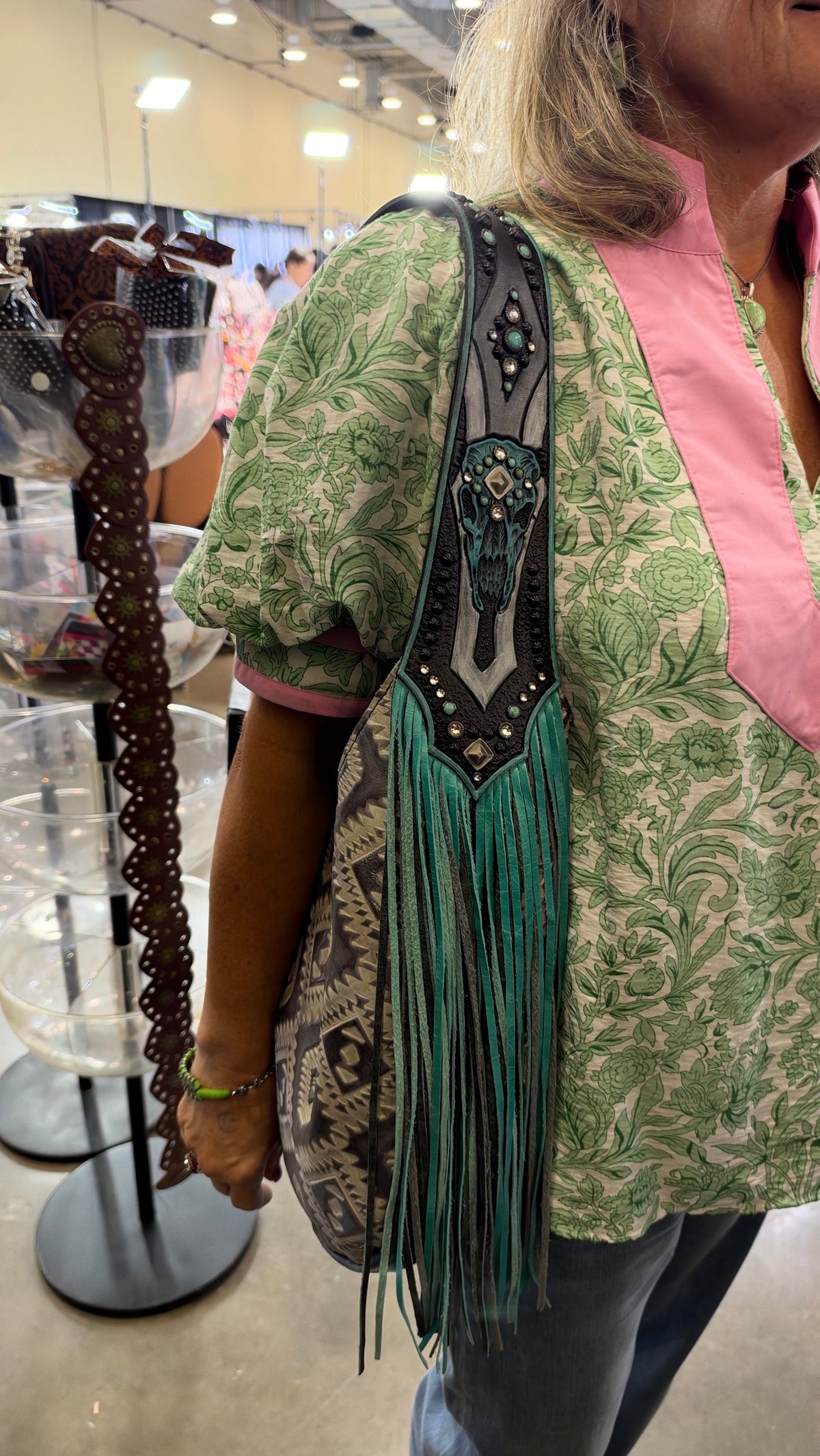 Heritage Brand bag No. 3818 worn on the shoulder at the Dallas show, steer skull strap