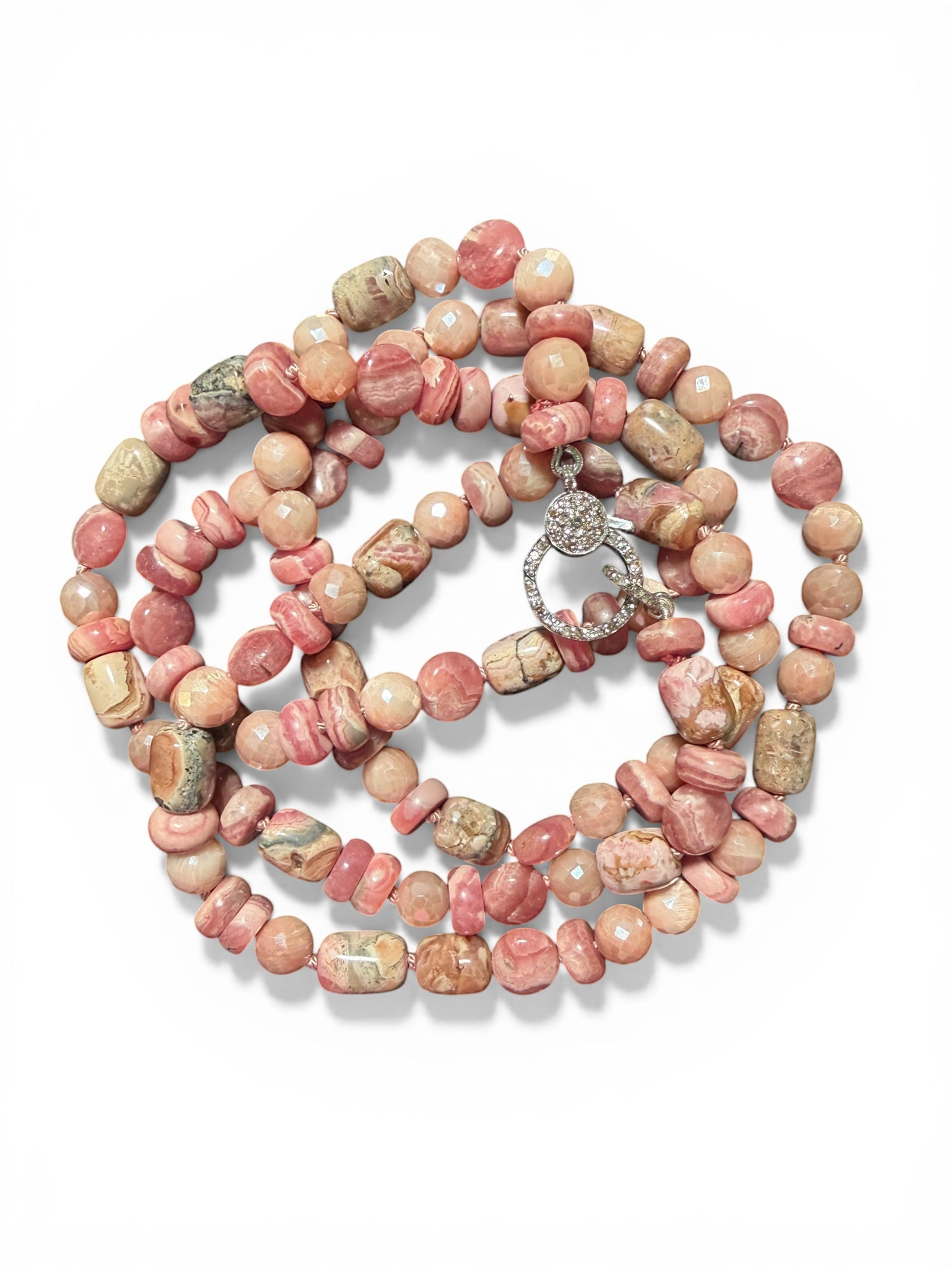35-inch rhodochrosite and peach moonstone necklace with sterling silver diamond clasp arranged in circular pattern on white background