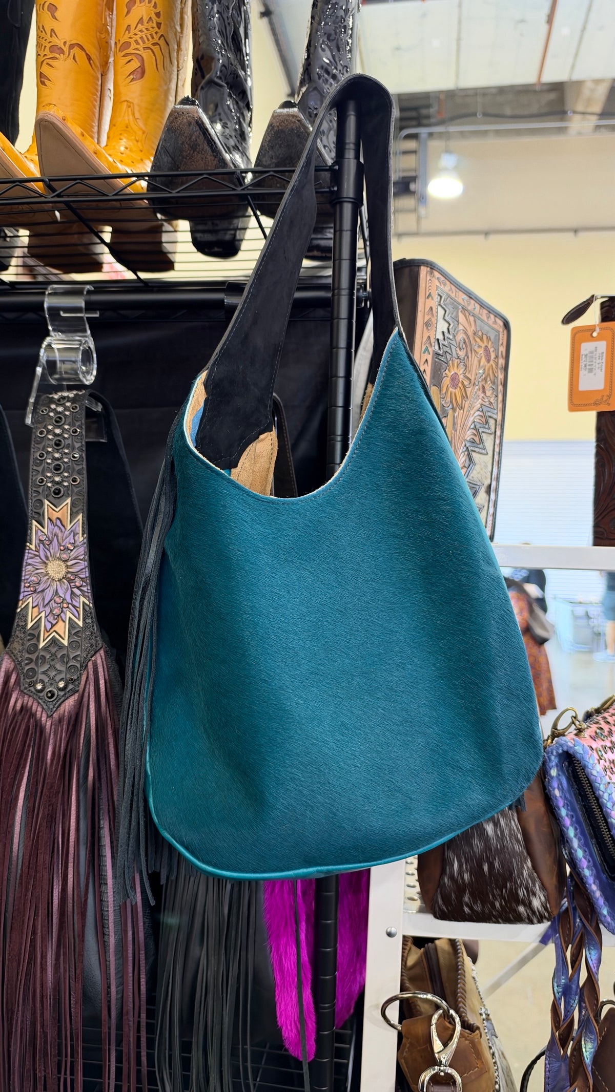 Heritage Brand Marilyn bag No. 1916, teal hair-on-hide side with black fringe