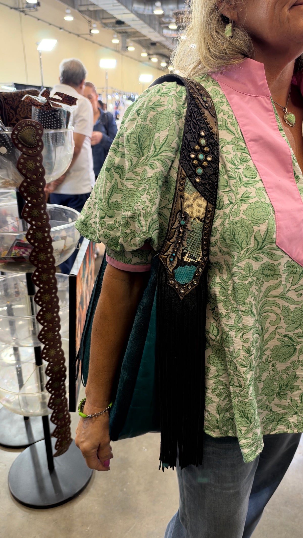 Heritage Brand Marilyn bag No. 1916 worn on the shoulder, teal side out, at the Dallas show