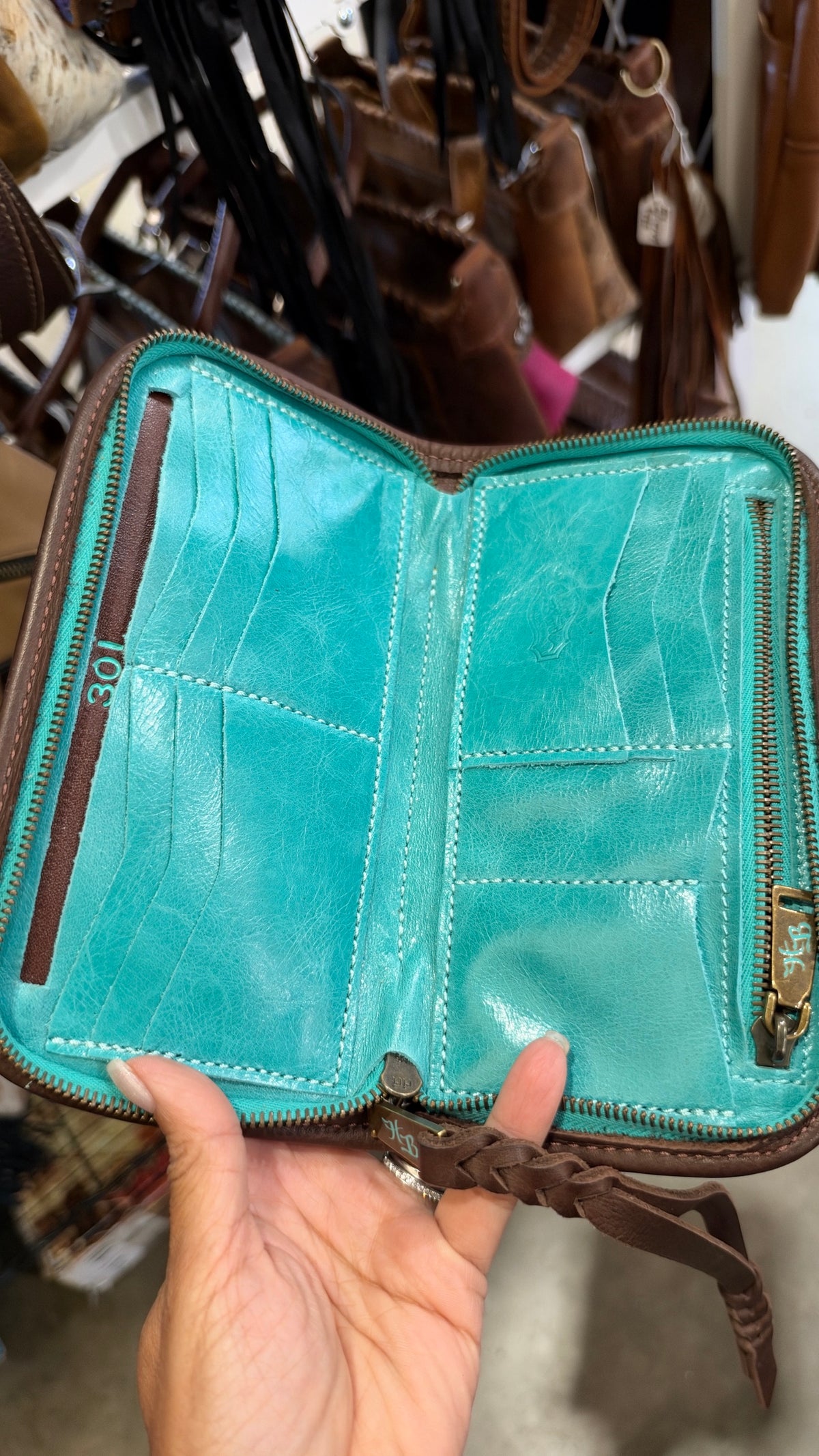 Heritage Brand wallet interior, turquoise leather with card slots and zip pocket