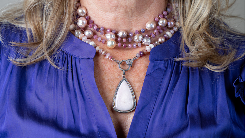 Text on a blue background about layering necklaces without tangles, with a person wearing layered necklaces.