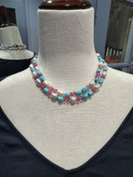 Diamond and Pearl and Topaz necklace styled for wear showing scale and drape