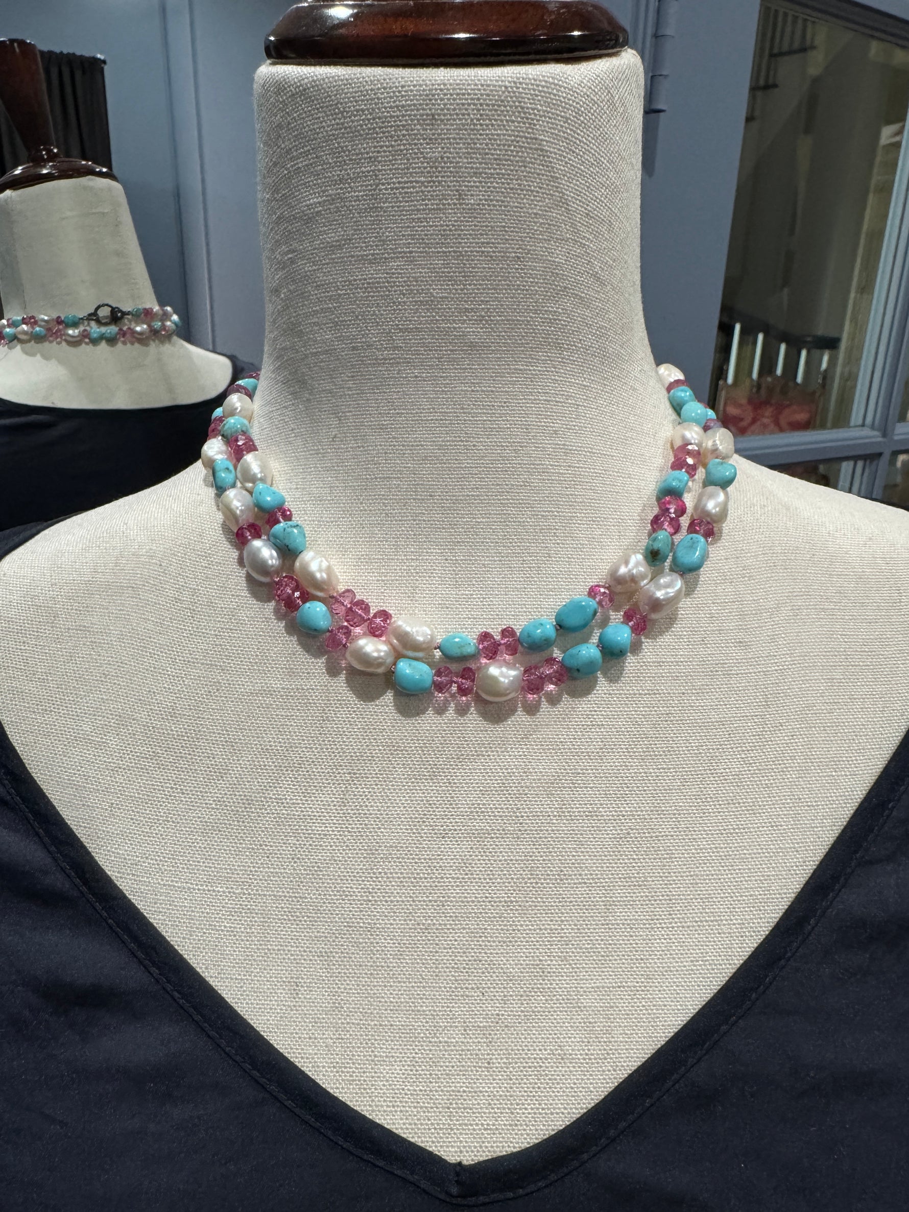 Diamond and Pearl and Topaz necklace styled for wear showing scale and drape