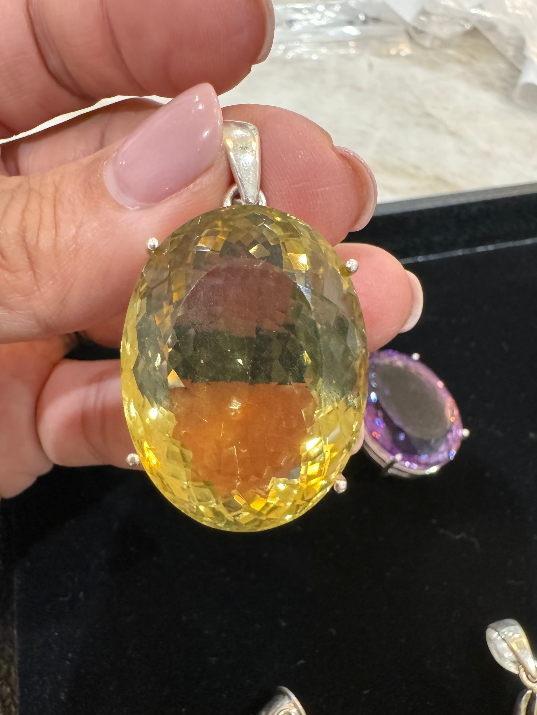 Amethyst and Citrine and Diamond pendant styled for wear showing scale and drape