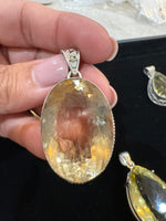 Amethyst and Citrine and Diamond pendant alternate angle showing natural stone variation
