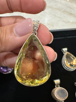 Amethyst and Citrine and Diamond pendant alternate angle showing natural stone variation