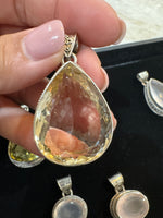 Amethyst and Citrine and Diamond pendant alternate angle showing natural stone variation