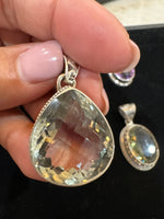 Amethyst and Citrine and Diamond pendant alternate angle showing natural stone variation