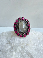 Diamond and Labradorite and Ruby ring styled for wear showing scale and drape