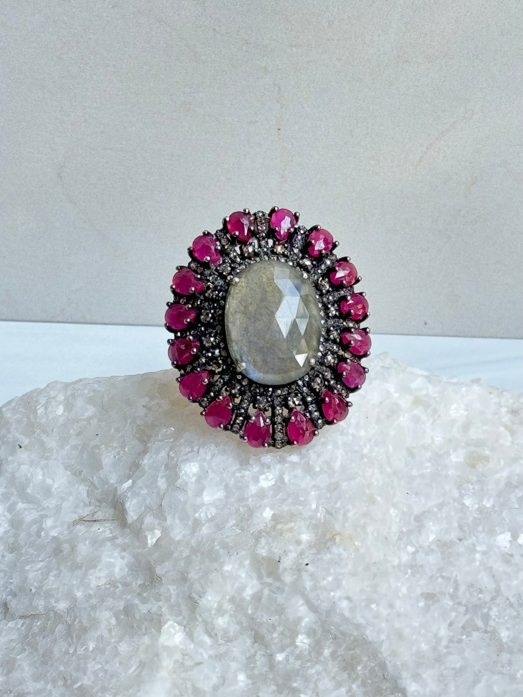Diamond and Labradorite and Ruby ring styled for wear showing scale and drape