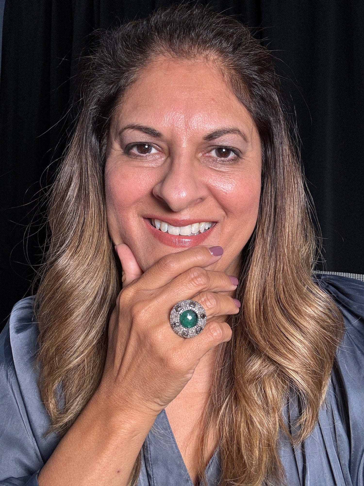 Detail view of Diamond and Emerald ring showing gemstone color and texture