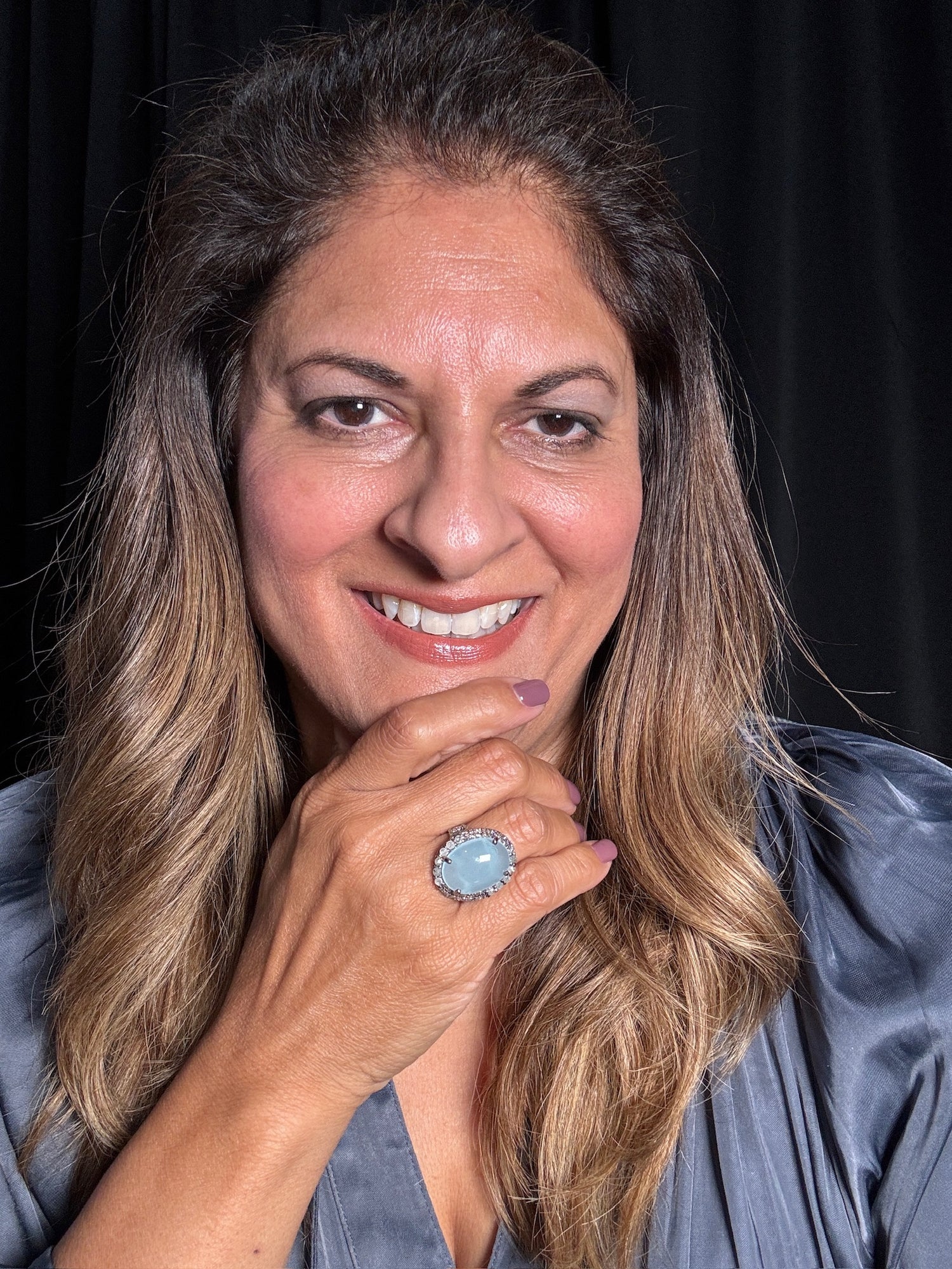 Detail view of Aquamarine and Diamond ring showing gemstone color and texture