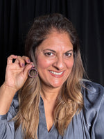 Detail view of Diamond and Ruby earrings showing gemstone color and texture