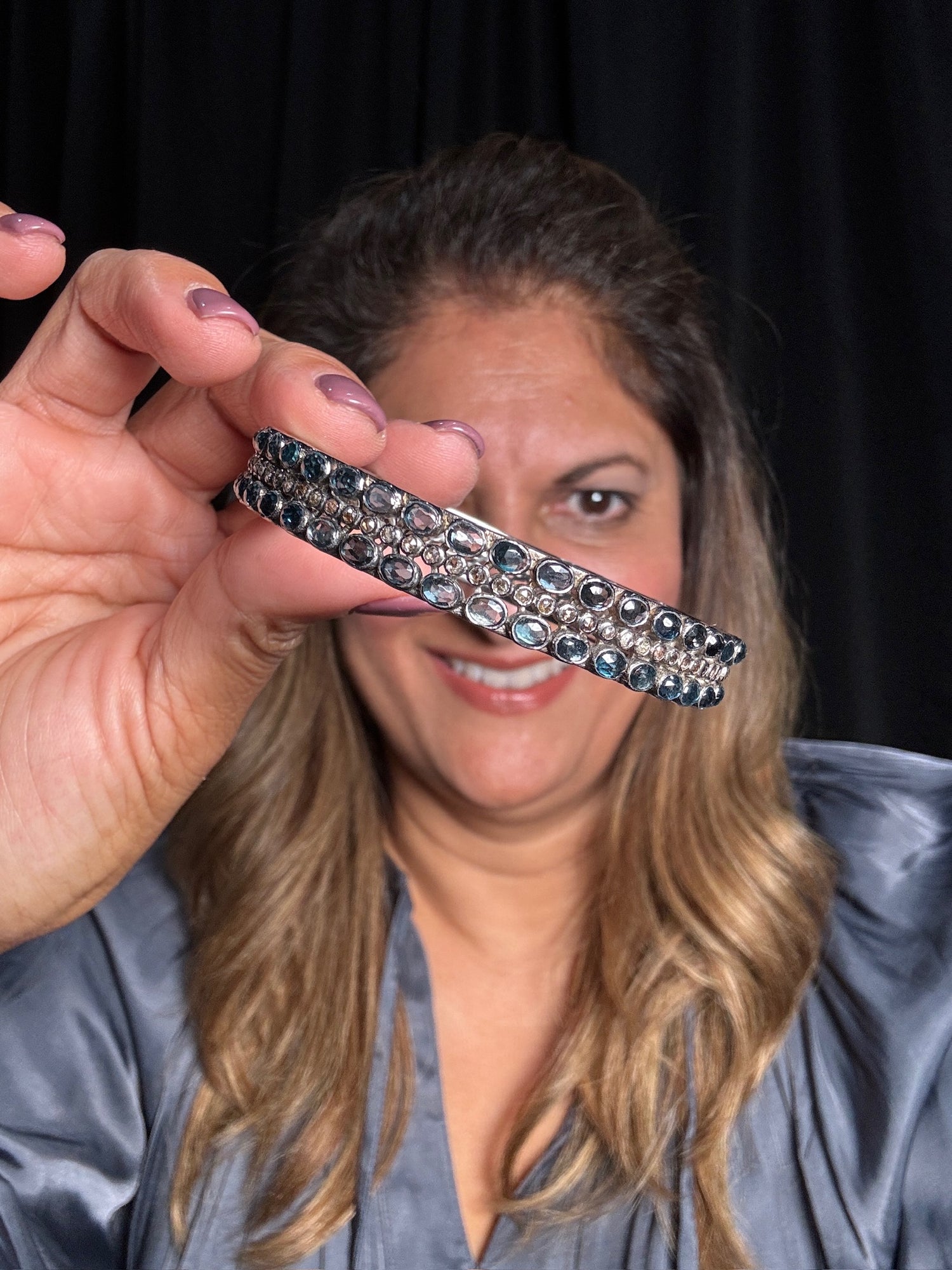 Detail view of London Blue Topaz and Diamond bracelet showing gemstone color and texture