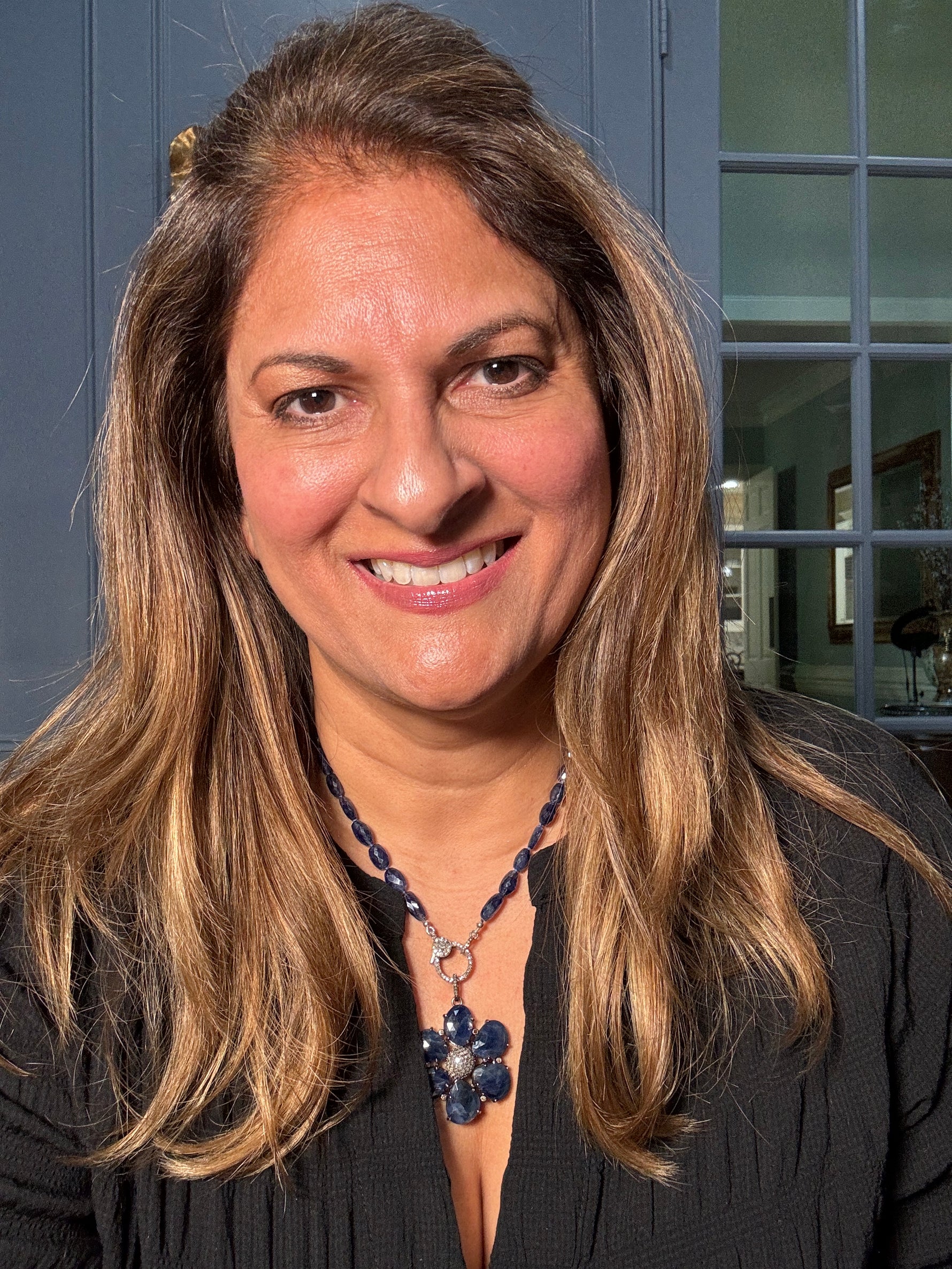 Detail view of Diamond and Sapphire necklace pendant combo showing gemstone color and texture