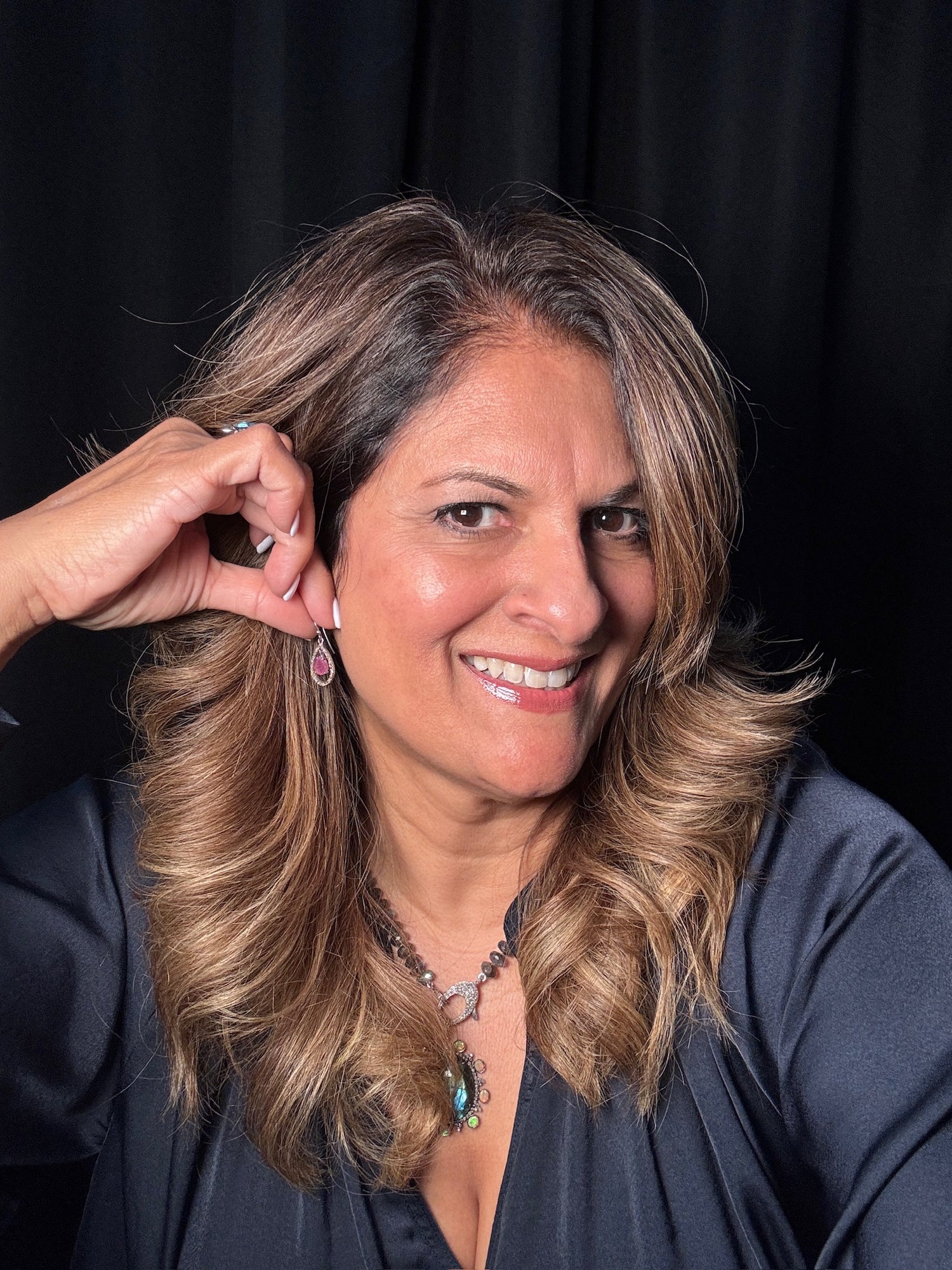 Detail view of Diamond and Ruby earrings showing gemstone color and texture