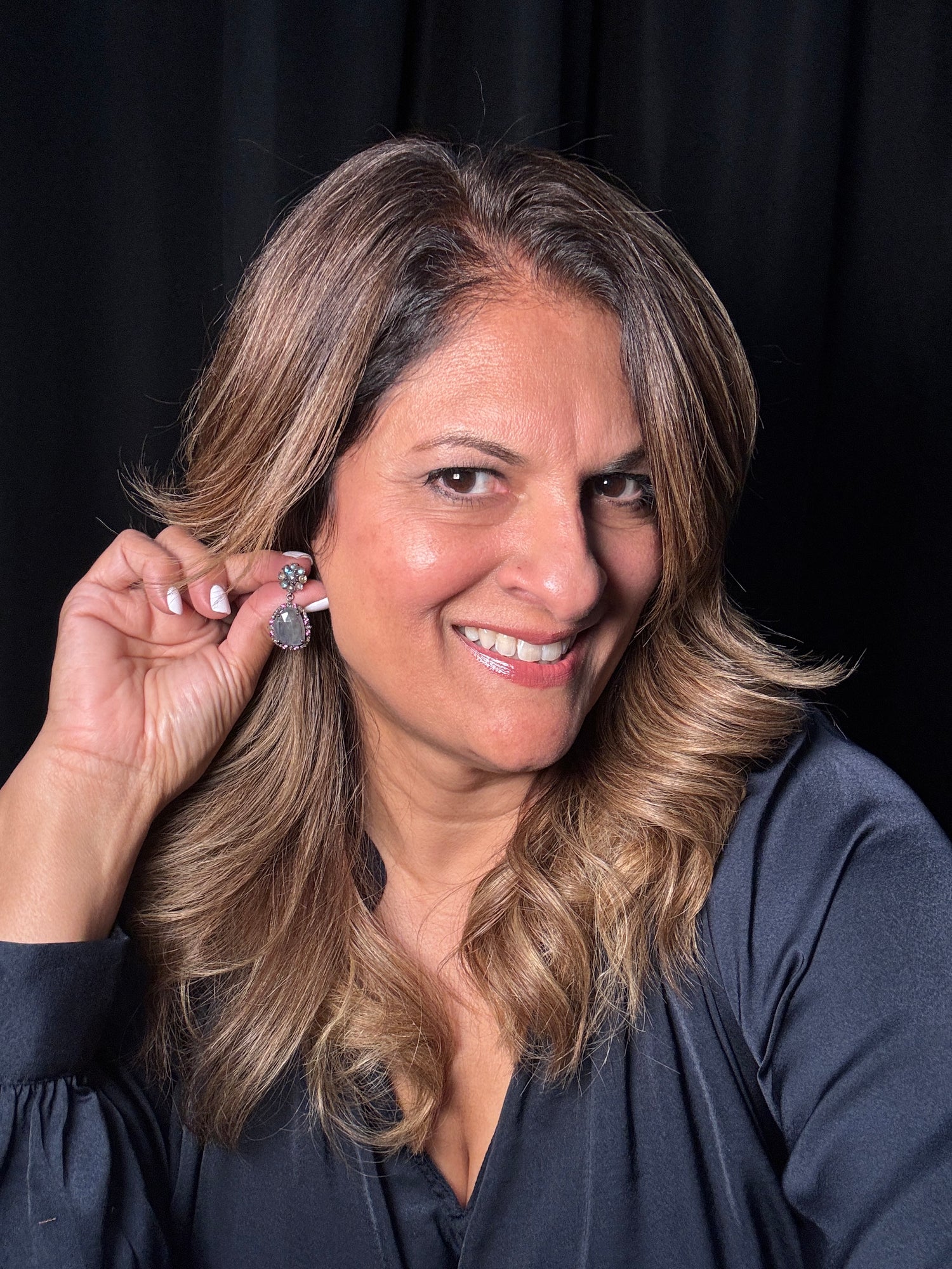 Detail view of Diamond and Labradorite and Sapphire earrings showing gemstone color and texture