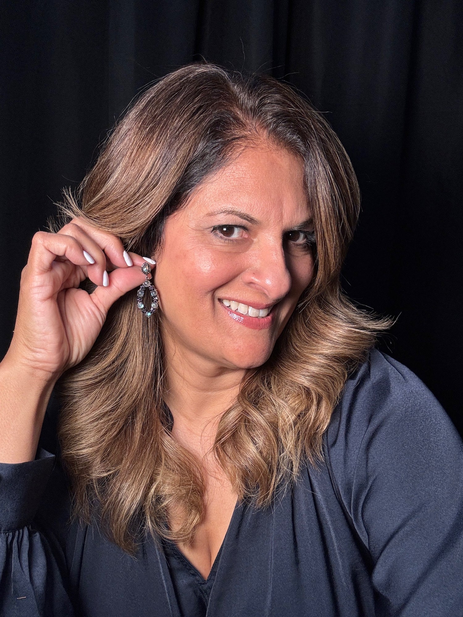 Detail view of Black Spinel and Labradorite earrings showing gemstone color and texture