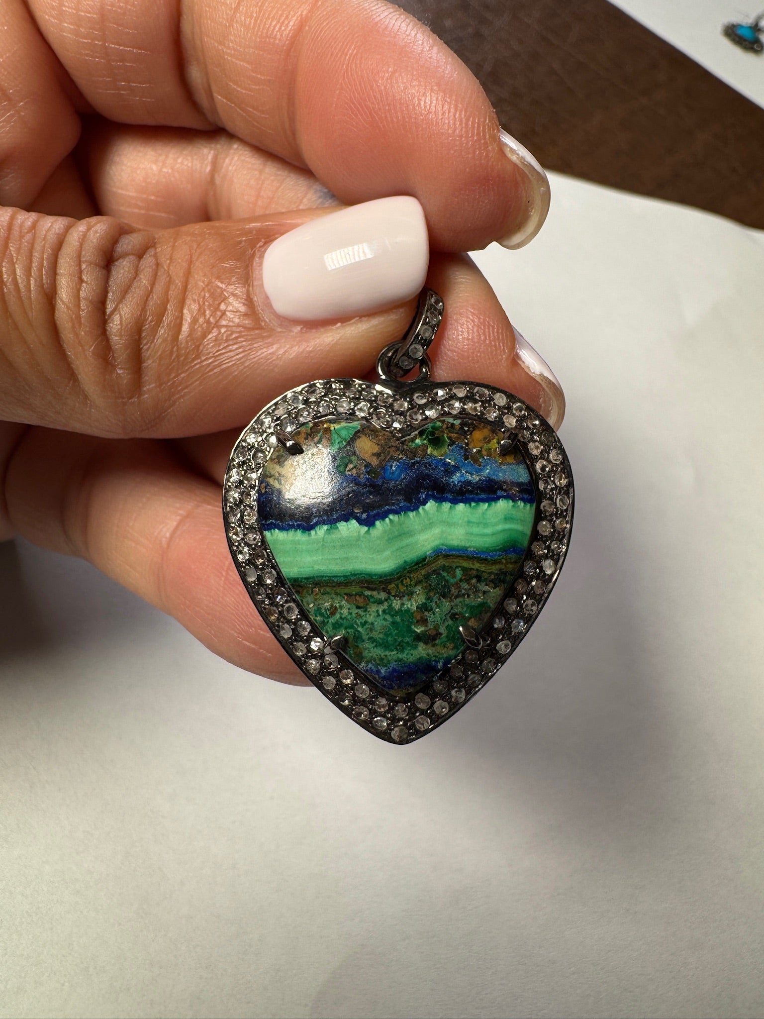Opal jewelry alternate angle showing natural stone variation