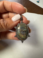 Opal jewelry alternate angle showing natural stone variation