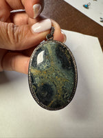 Opal jewelry alternate angle showing natural stone variation