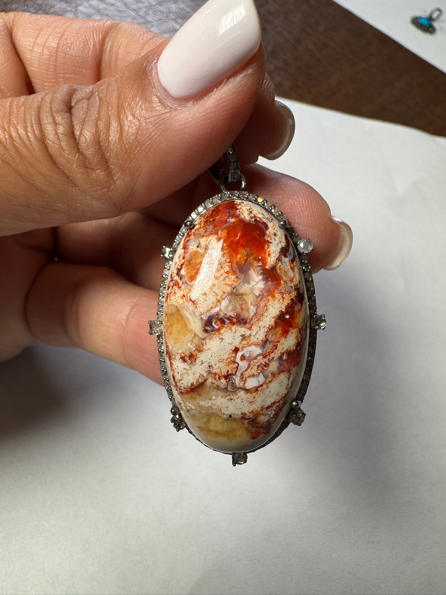 Opal jewelry alternate angle showing natural stone variation