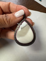 Opal jewelry alternate angle showing natural stone variation