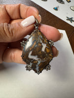 Opal jewelry alternate angle showing natural stone variation