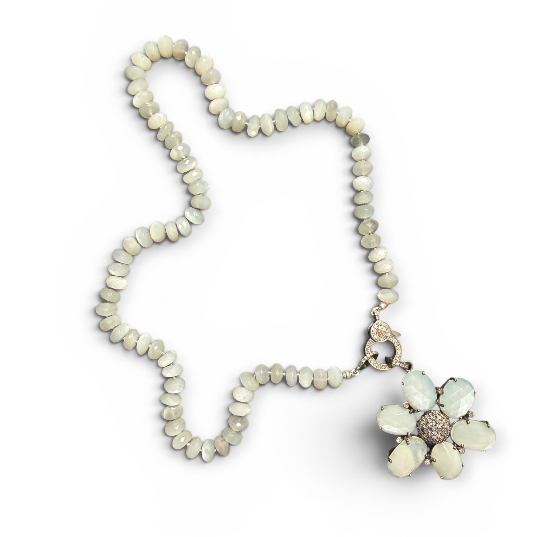 Necklace with a floral pendant on a white background