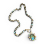 Necklace with gemstone pendant on a white background