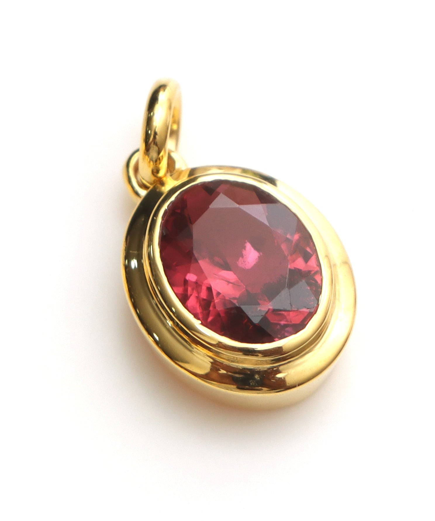 Large oval pink tourmaline pendant in 14K gold bezel | Ulka Rocks
