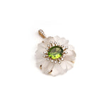 Carved rock crystal flower pendant with peridot center and diamond halo in 14K gold | Ulka Rocks