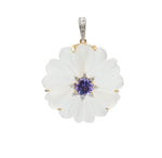 Carved rock crystal flower pendant with faceted tanzanite center and diamond accents in 18K gold | Ulka Rocks