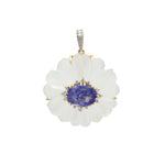Carved rock crystal flower pendant with tanzanite cabochon center and diamond accents in 18K gold | Ulka Rocks