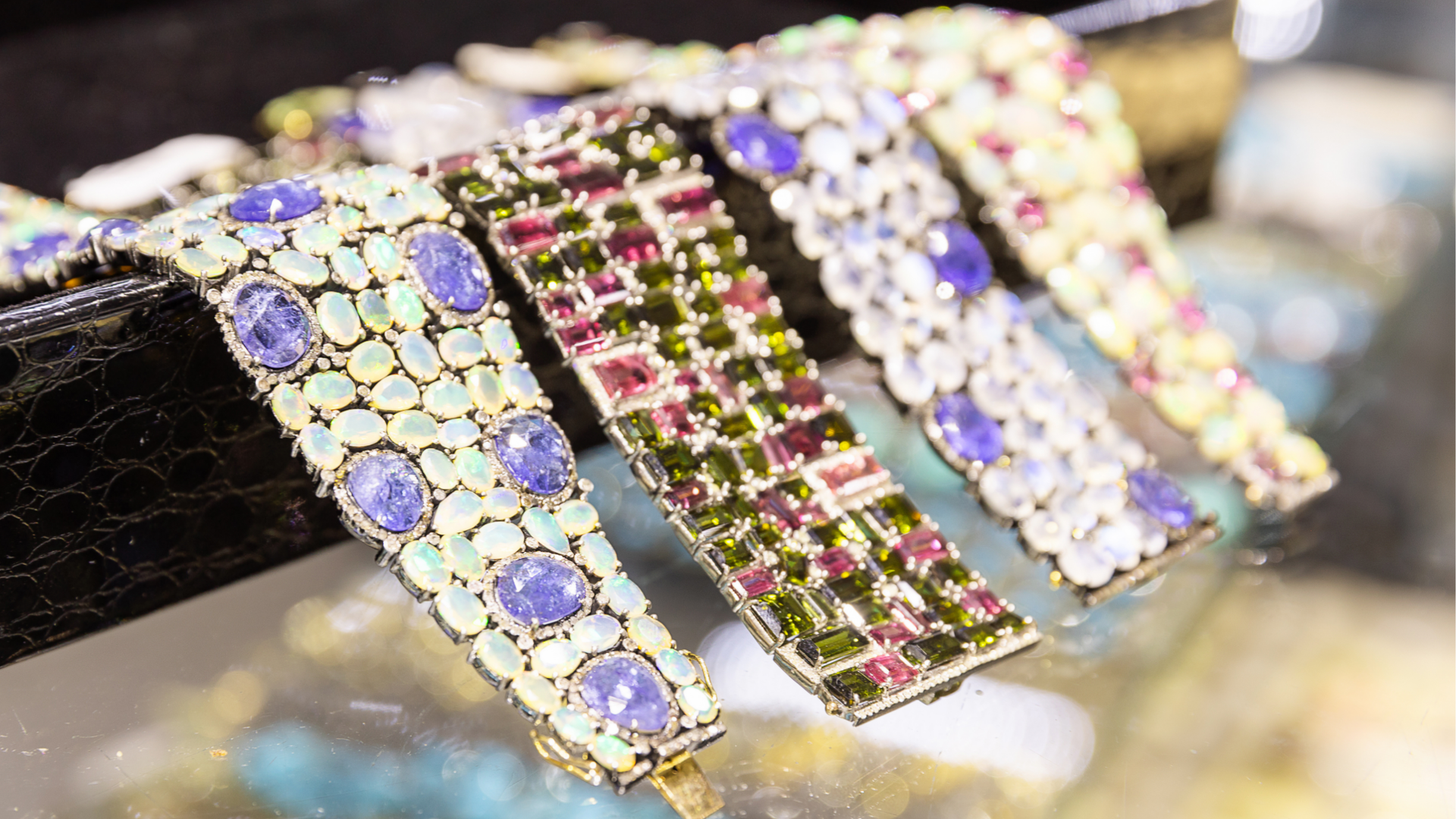 Showing bracelets made with high end colored gemstones