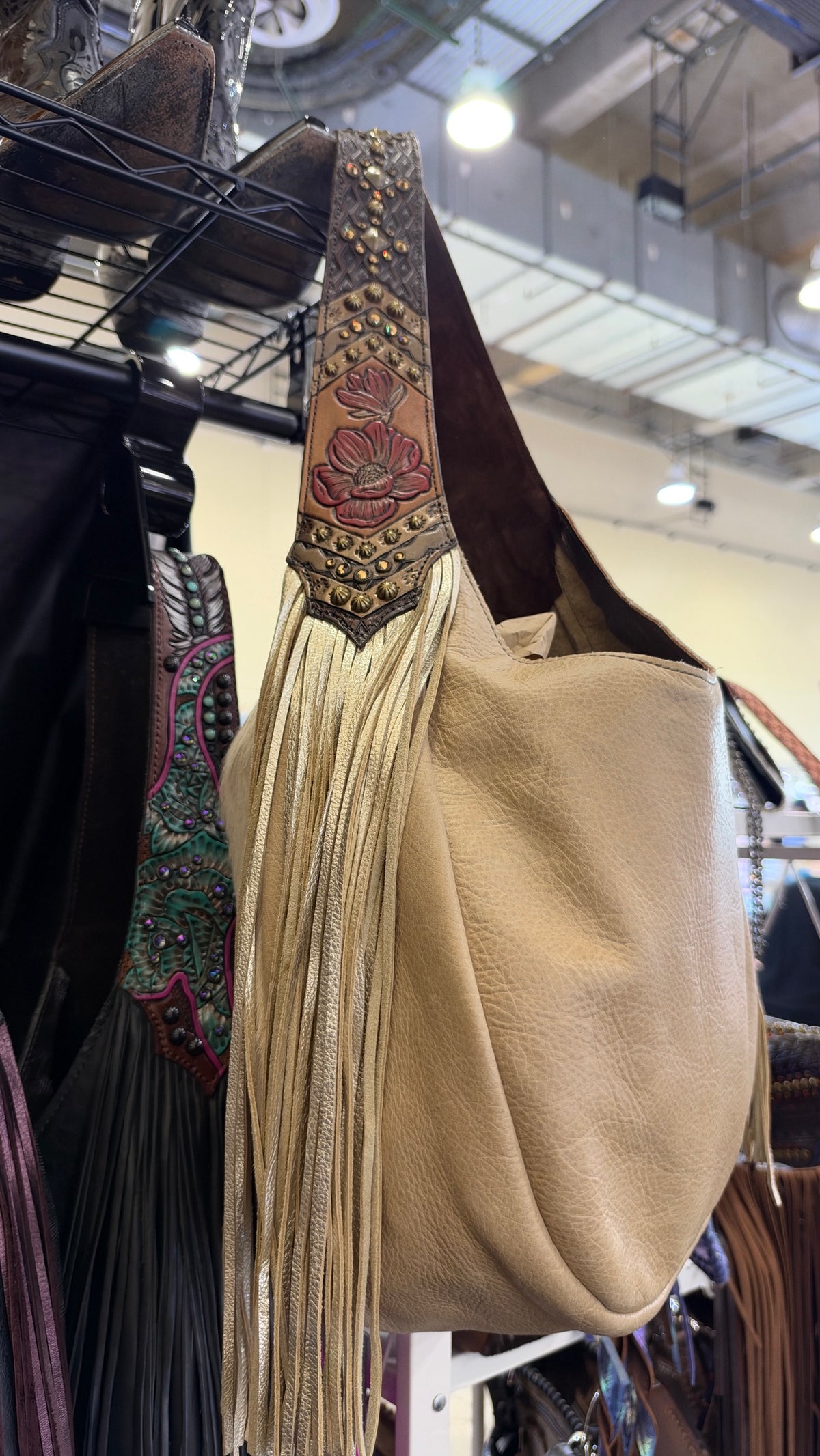 Heritage Brand bag, red poppy tooled strap and champagne fringe close up