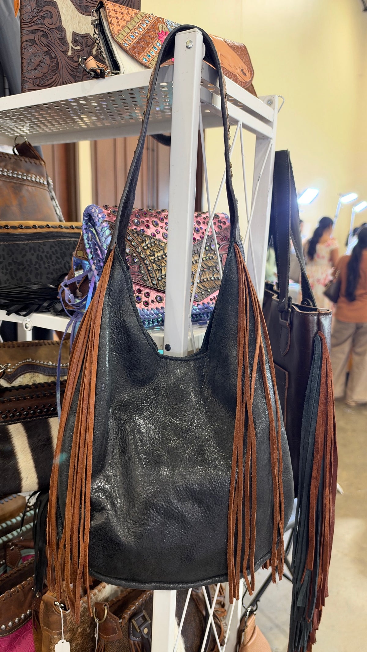 Heritage Brand Marilyn bag, distressed black leather hobo with cognac fringe and tooled sunflower strap