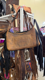 Back of the zebra hide bag, distressed tan leather with the Designer Custom Leather stamp