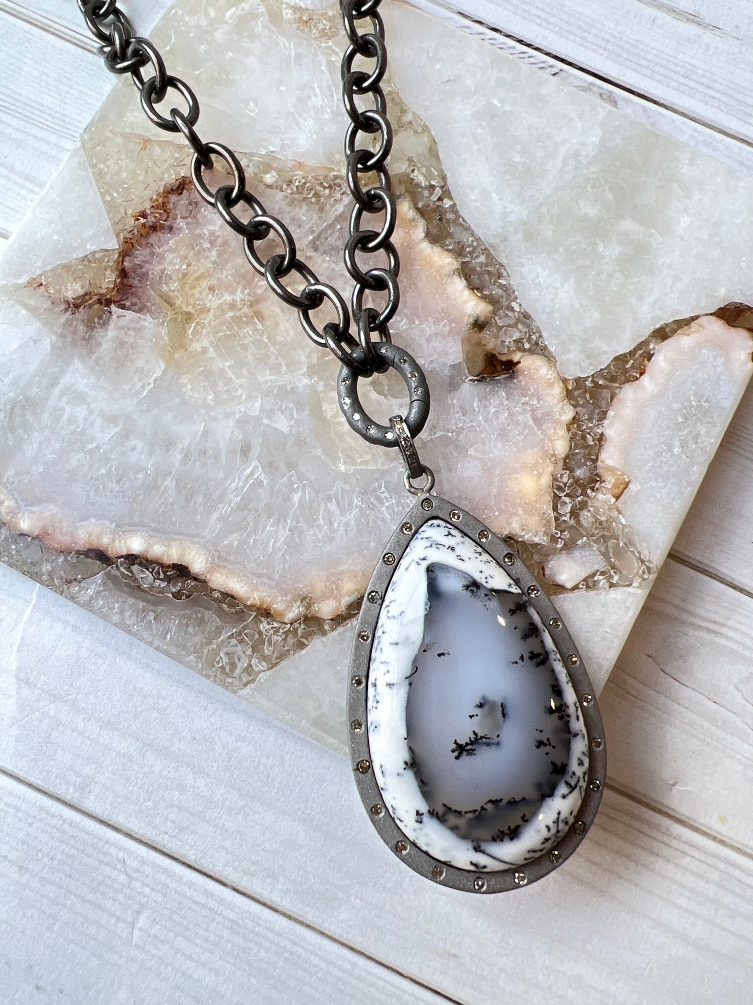 Detail view of Diamond and Opal necklace pendant combo showing gemstone color and texture