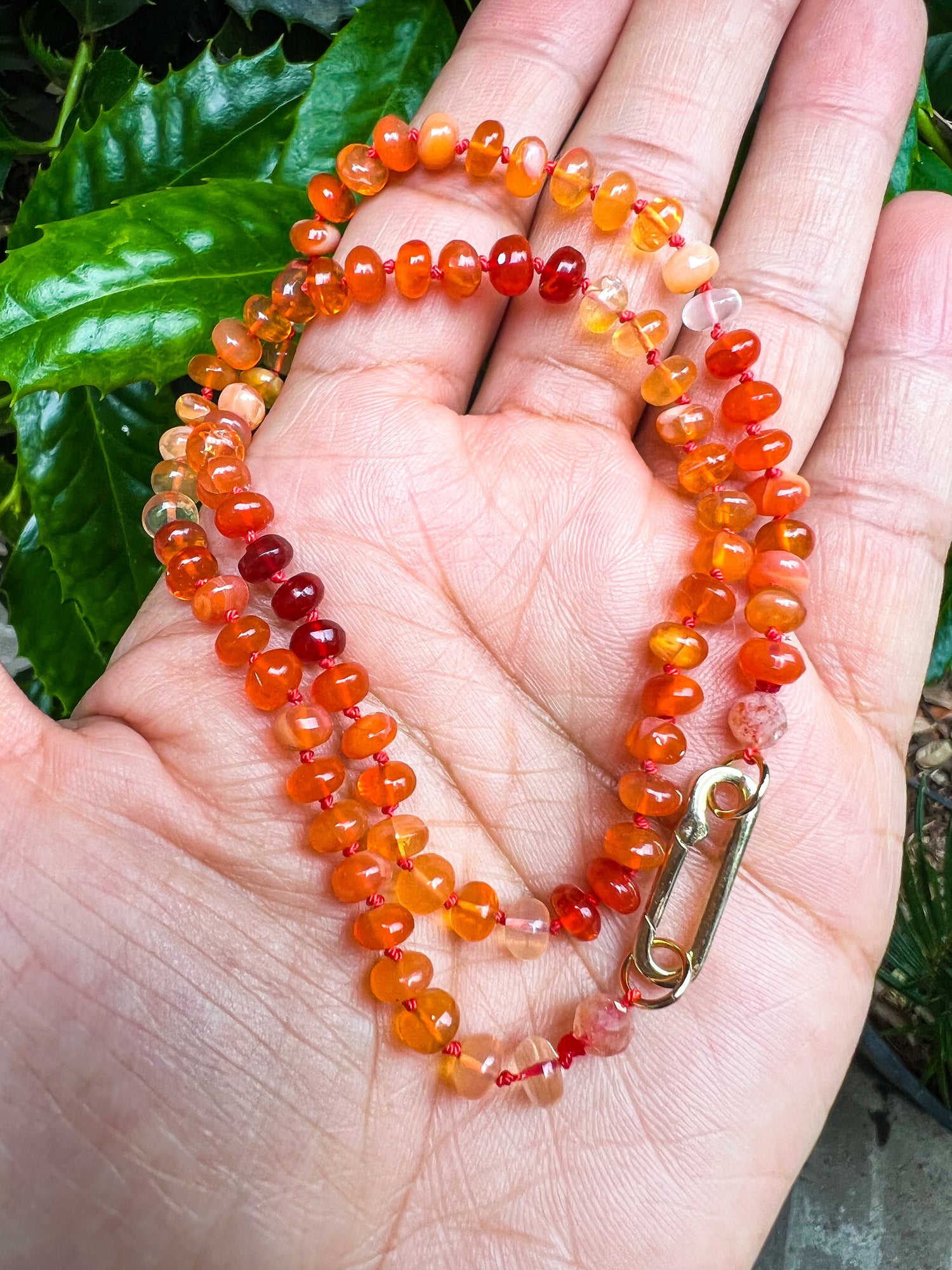 Detail view of Fire Opal jewelry showing gemstone color and texture