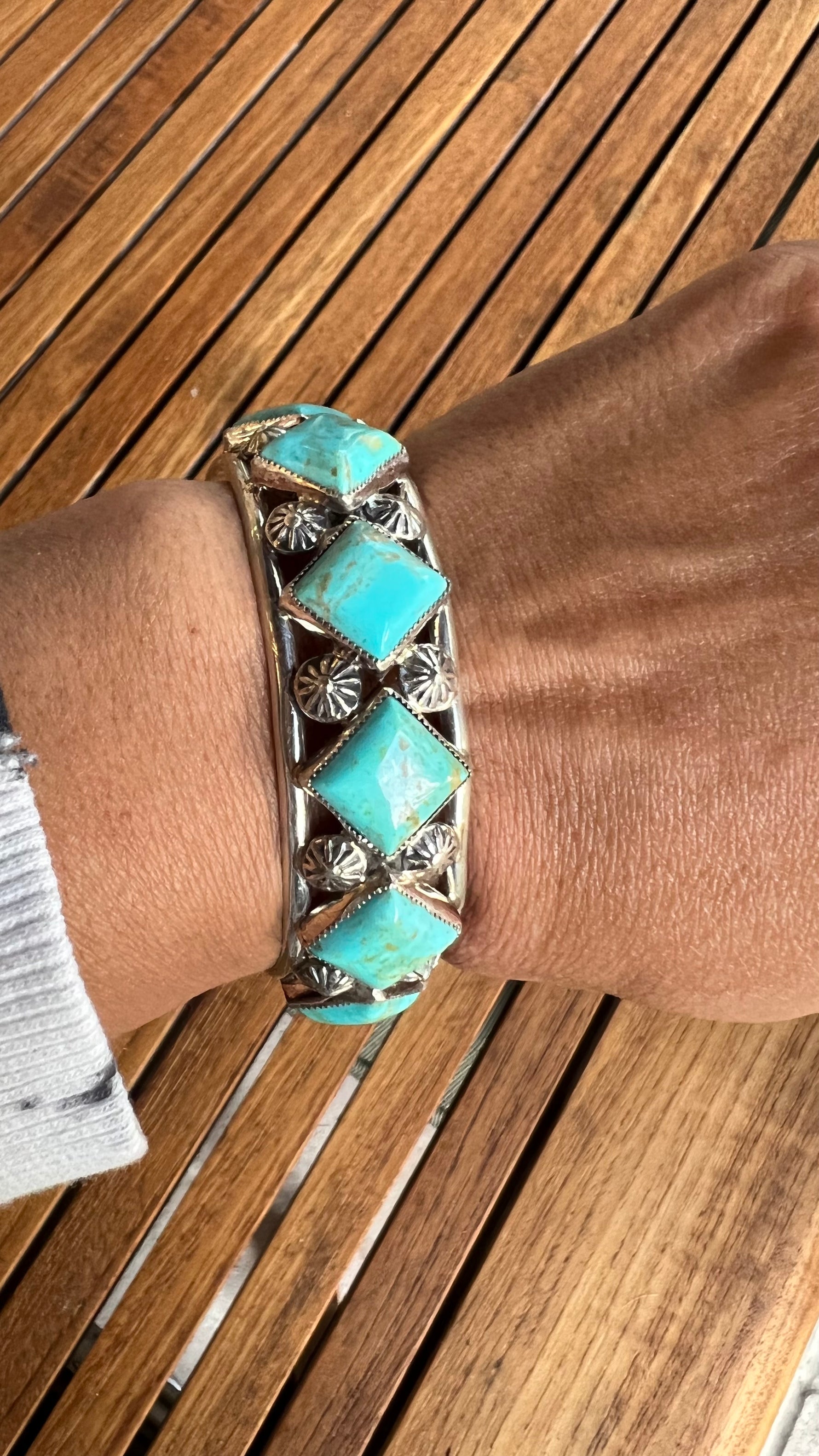 Turquoise bracelet styled for wear showing scale and drape
