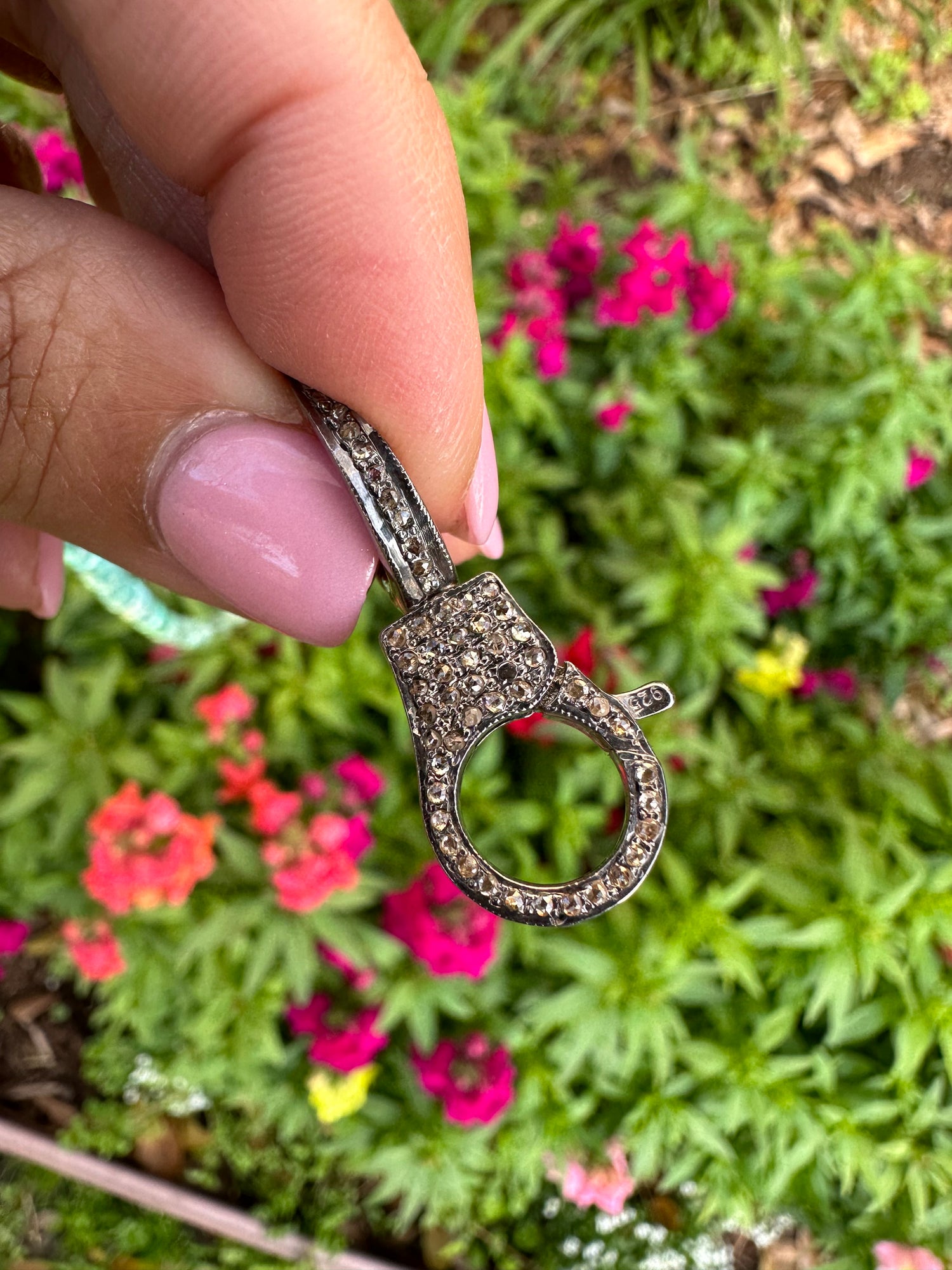 Detail view of Diamond pendant showing gemstone color and texture