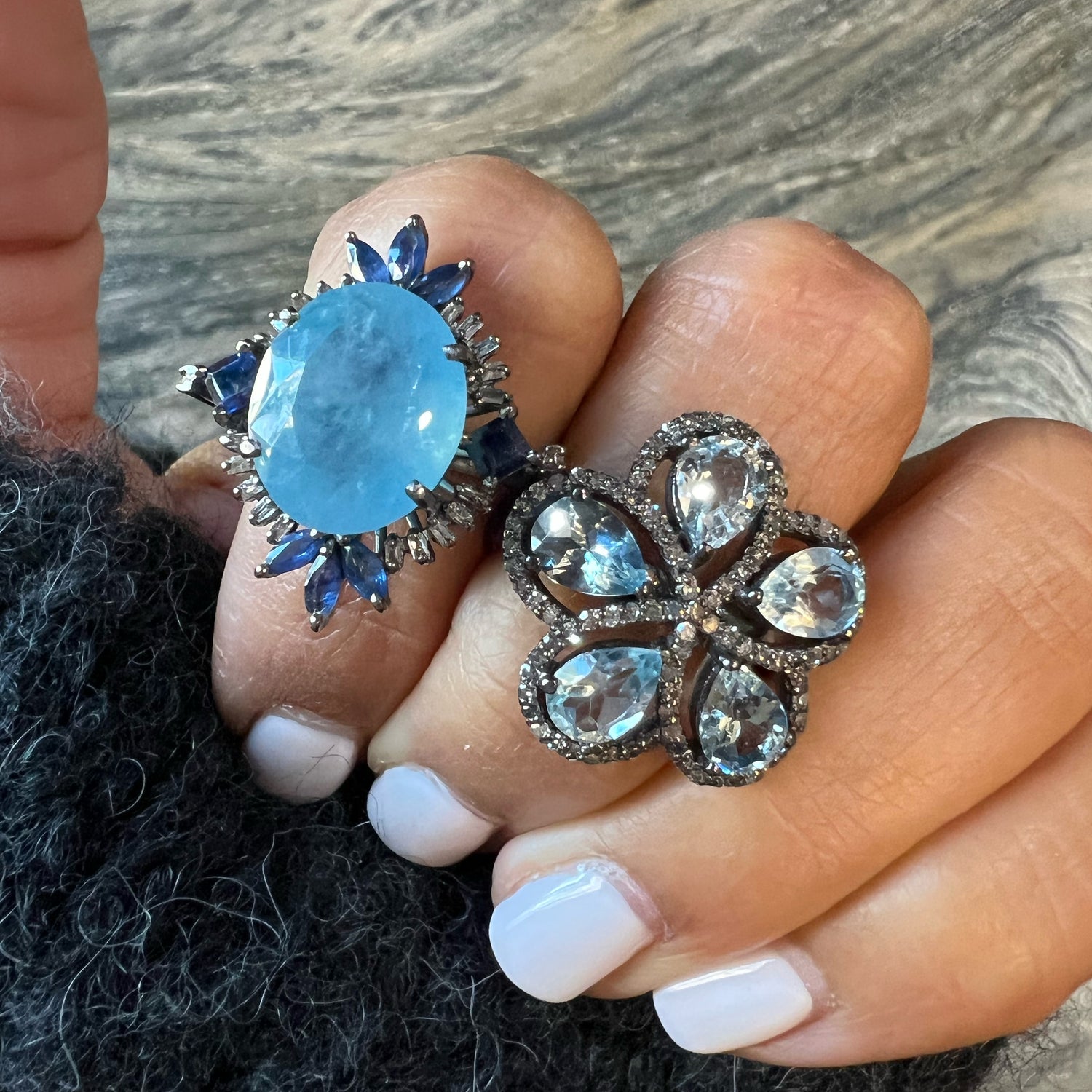 Detail view of Aquamarine and Diamond and Sapphire ring showing gemstone color and texture